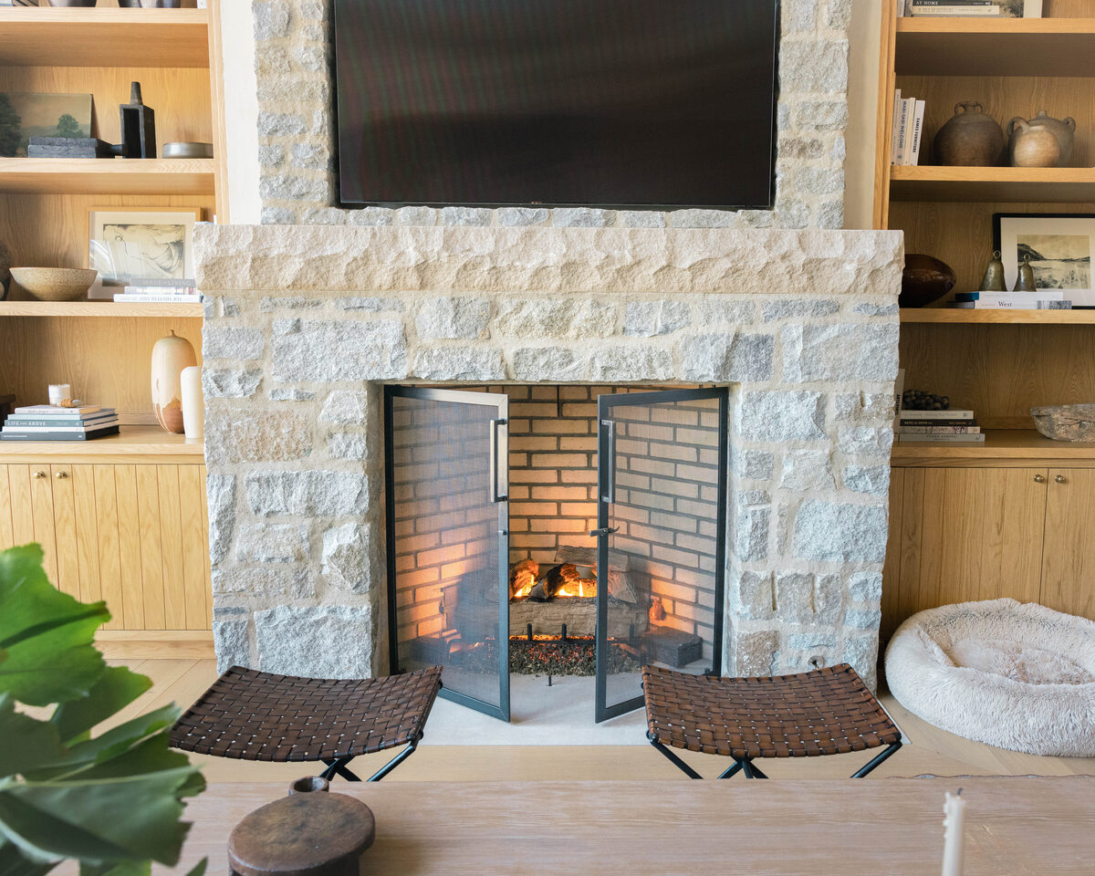 Custom fire screen crafted in collaboration with Amber Lewis Interiors