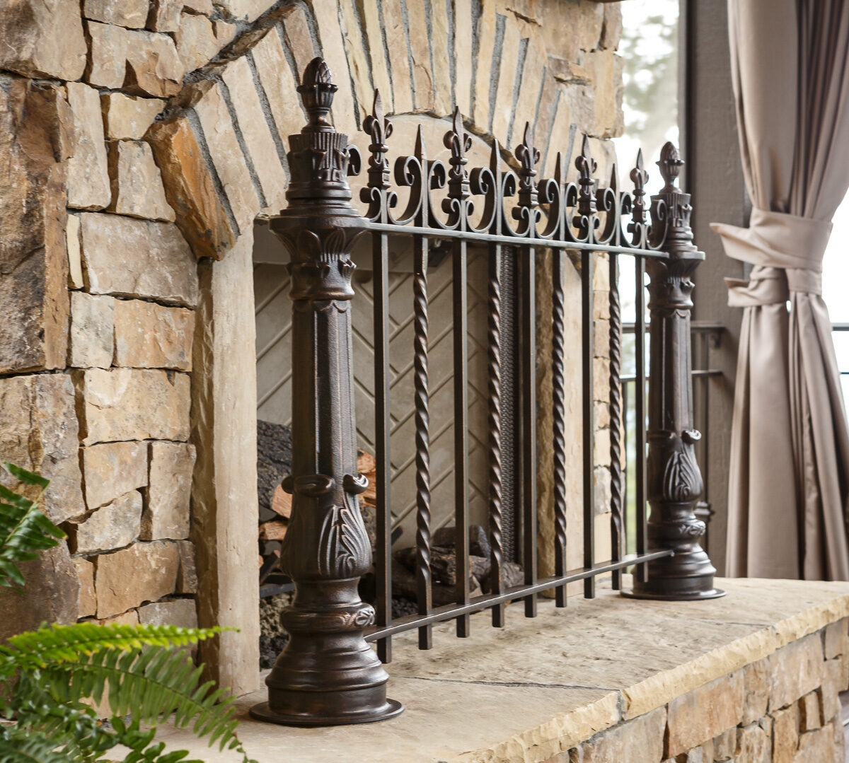 Victorian-inspired fully forged fire screen echoing New Orleans ironwork