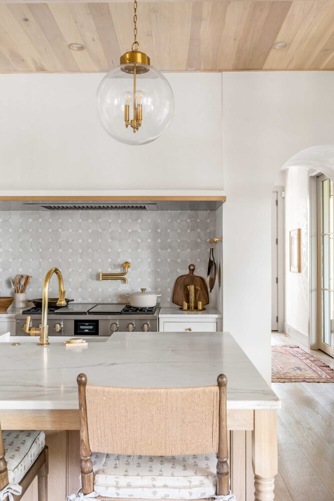 Understated plaster range hood melting into the wall at the Southern Living Idea House